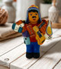 Ekeko doll figurine, 5" tall, depicting a man with a guitar, symbolizing abundance and prosperity, handmade in Peru.
