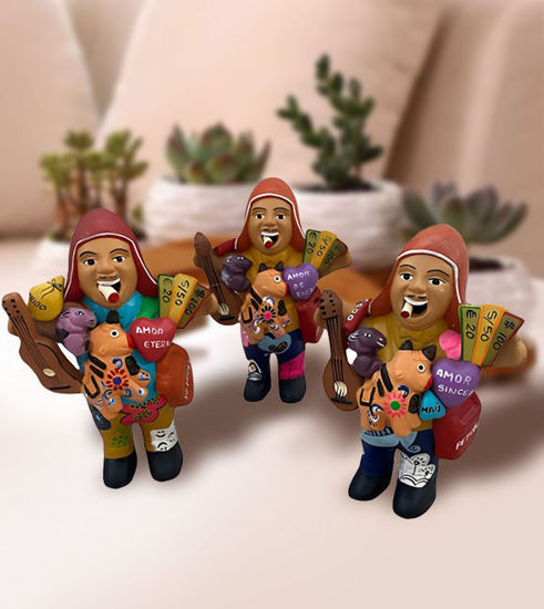 Colorful Ekeko doll figurine of a man holding a guitar, symbolizing abundance and prosperity, handcrafted in Peru.