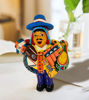 Handmade 9-inch Ekeko doll, a Peruvian symbol of abundance, depicting a man with a guitar, representing prosperity and good luck.
