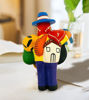 Ekeko figurine, a Peruvian charm of abundance, featuring a man holding a guitar, symbolizing wealth and positive energy.