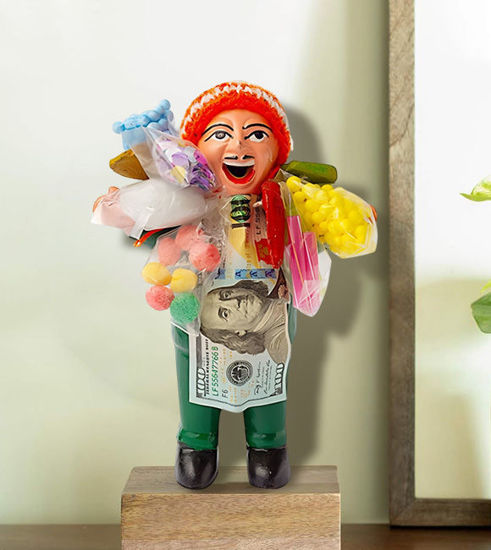 Handmade 7" Ekeko figurine of a man holding a money bag, symbolizing abundance and good luck in Andean culture.