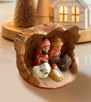 Handmade ceramic nativity scene featuring the Holy Family, crafted by Peruvian artisans using traditional techniques.