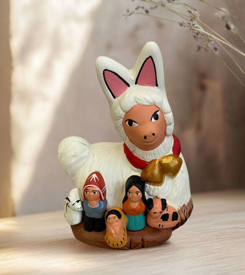 Handmade terracotta figurine of the Holy Family with a llama, showcasing Peruvian artistry in a festive nativity scene.