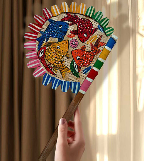 Colorful hand-painted wooden fan featuring intricate fish designs, showcasing Bengal Pattachitra folk art for home decor.