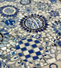 Handcrafted blue and white floral mosaic table, featuring unique Portuguese tile design for versatile decor.