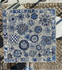 Elegant blue and white floral mosaic table adorned, highlighting artisanal Portuguese craftsmanship for any setting.
