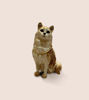 Decorative cat figurine trinket box with glossy enamel and crystal details, placed on a white surface for display.