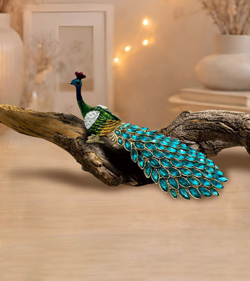 Colorful peacock figurine with a rhinestone tail on a white background, serving as a decorative trinket box for small treasures.