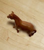 Handcrafted brown horse figurine made of wood, set against a white background, ideal for play and decorative use.